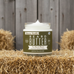 Open jar of Tallow Man Tobacco Vanilla Beard + Body Butter with front label visible.