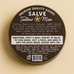 Back label of Tallow Man Hand Salve tin showing directions, ingredients and barcode on a warm beige background.