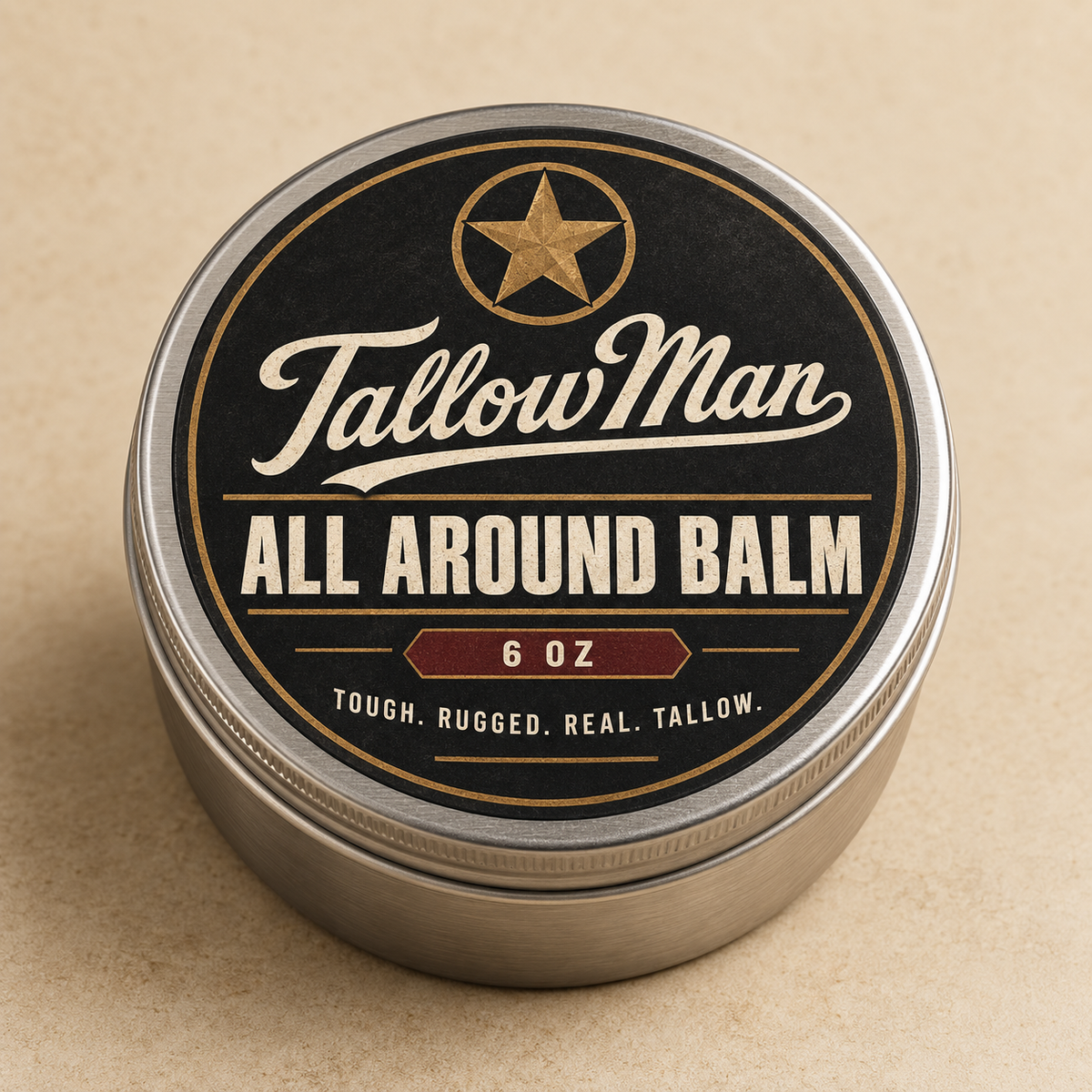 Tallow Man All Around Balm, 6 oz, in a closed silver tin on a warm stone surface.